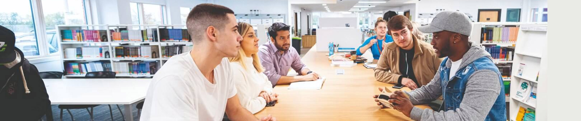 Students conversating in a library space