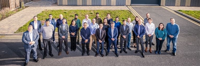 group shot of 20 people standing outside c-alps