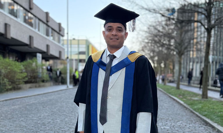 Harshad Chandrashekhar Surve in graduation robes