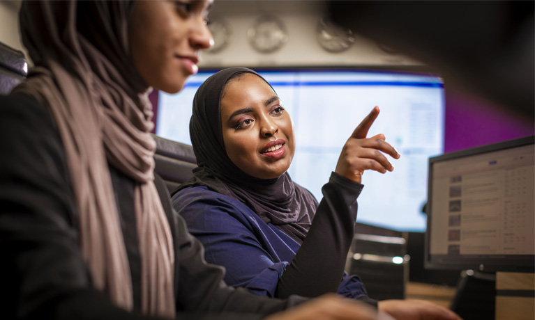 Students using the Bloomberg terminals on the Trading Floor