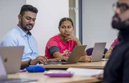 Students in a classroom working on laptops