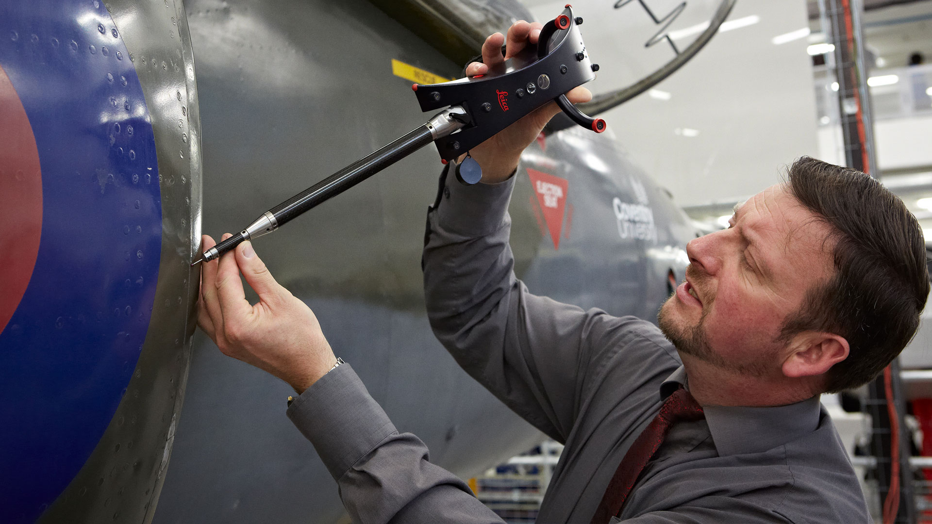 Engineer working on the outside of a plane