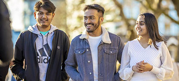 Students walking together smiling