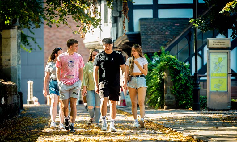 Group of students walking on campus