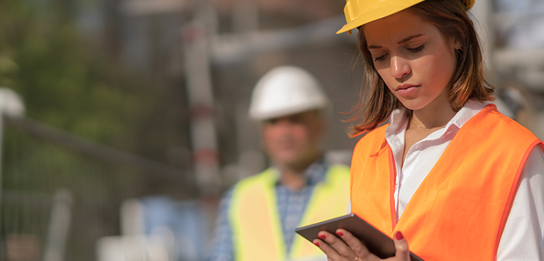 Female engineer works on tablet