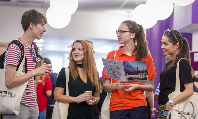 students talking with each other at an event