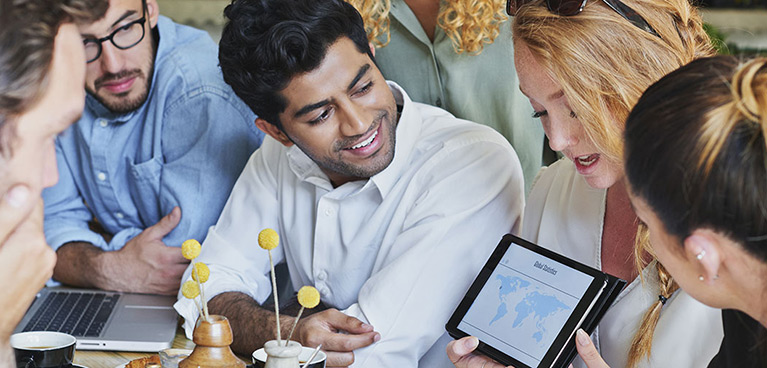 Students looking at a tablet presentation