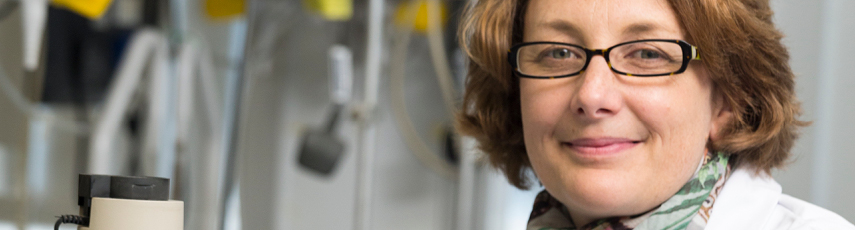 Closeup of a brunette lady wearing thick glasses