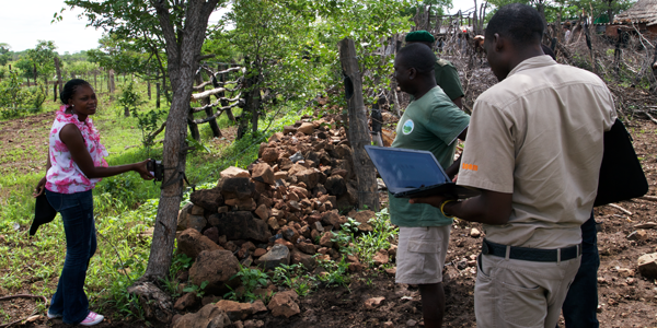 researchers in lion habitat