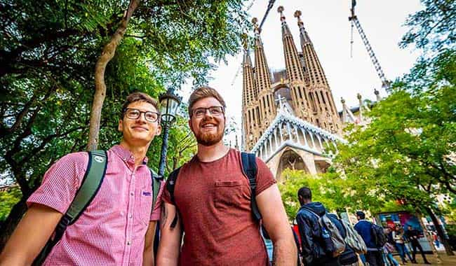 Two students on gap year standing with the Sagrada Família cathedral in the background