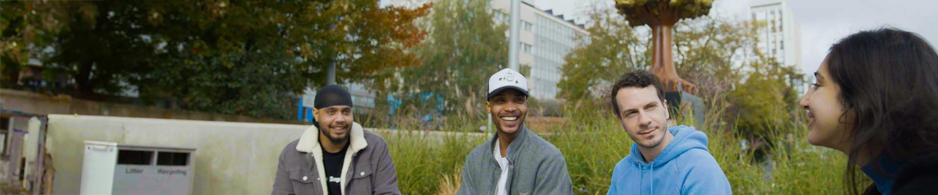 Group of students chatting outside campus