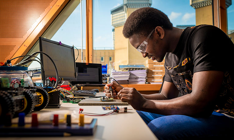 Student working at a computer desk