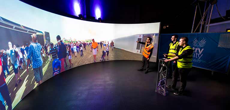 Two male students looking at a digital simulation screen