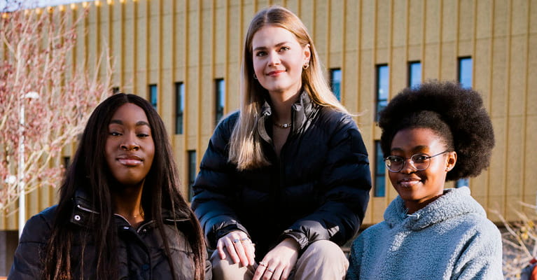 Three women smiling