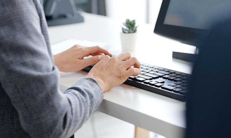 Soemone typing on a keyboard