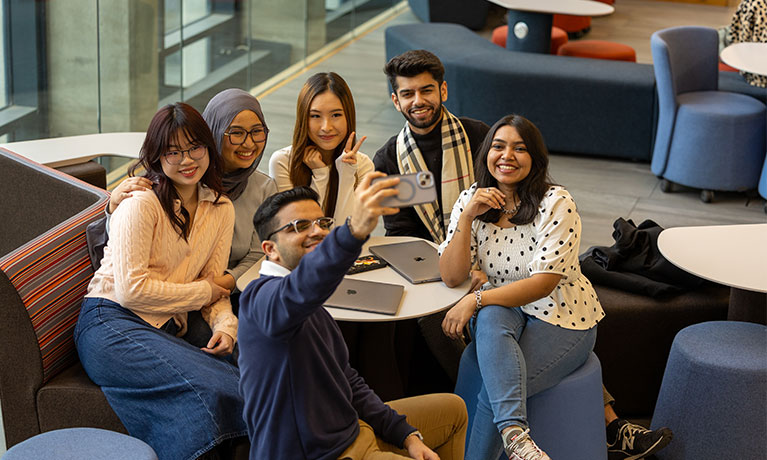 Students taking a selfie together in the Alison Gingell building