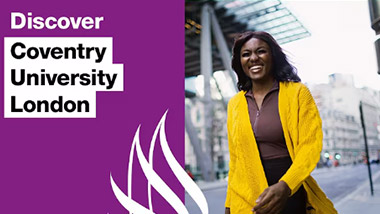 woman smiling outside of a university building