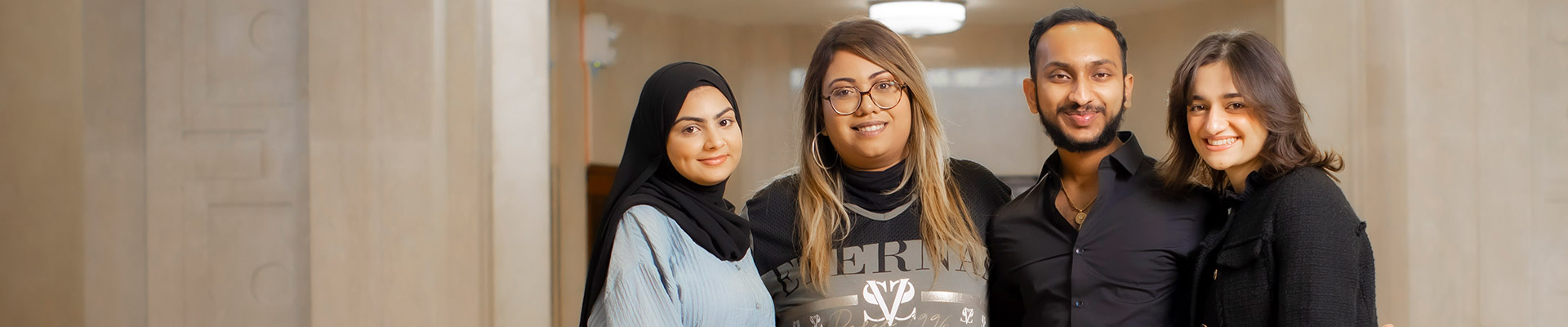 Group of students stood together smiling