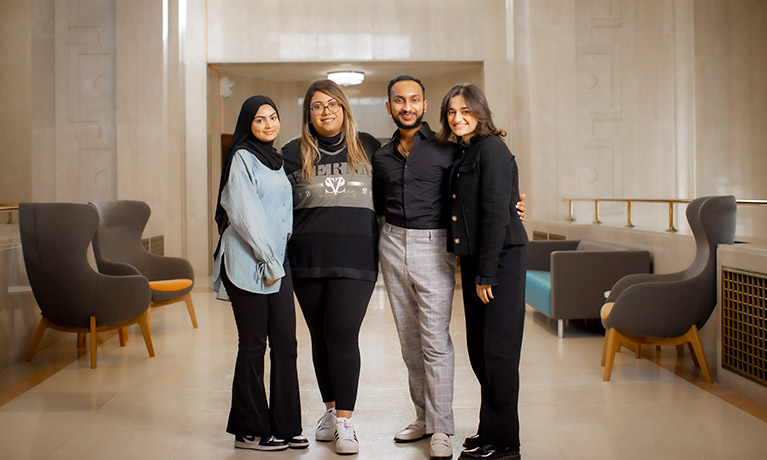 Group of students stood together smiling