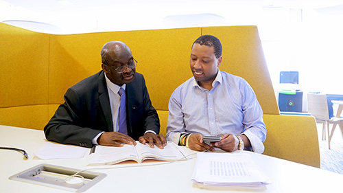 A student and tutor talking in a study booth