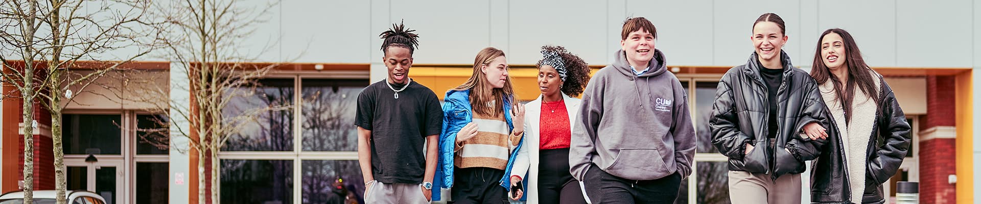 Group of students talking and laughing