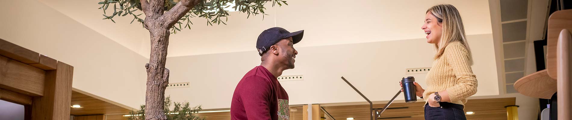 Students talking together in a university common room