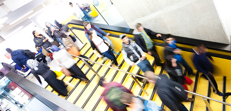 People walking inside the student hub