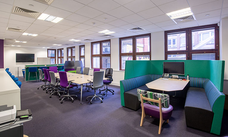 large room with tables and chairs 