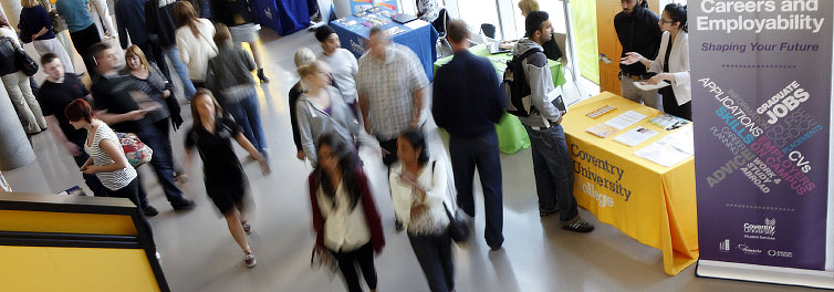 People walking through a campus building