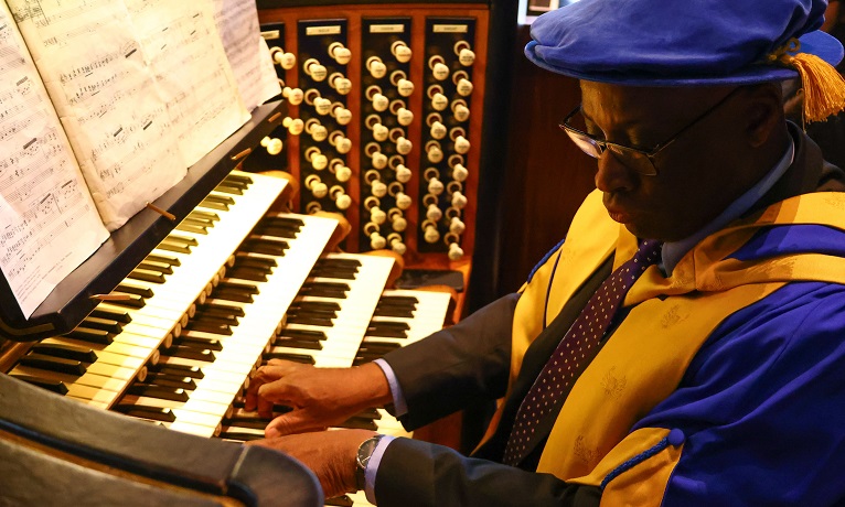 Portrait of wayne playing on a piano