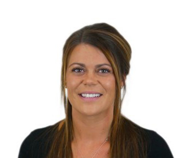 Charlotte Kane wearing a dark top against a white background.