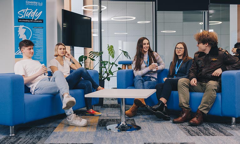 Group of students sat in a communal area talking