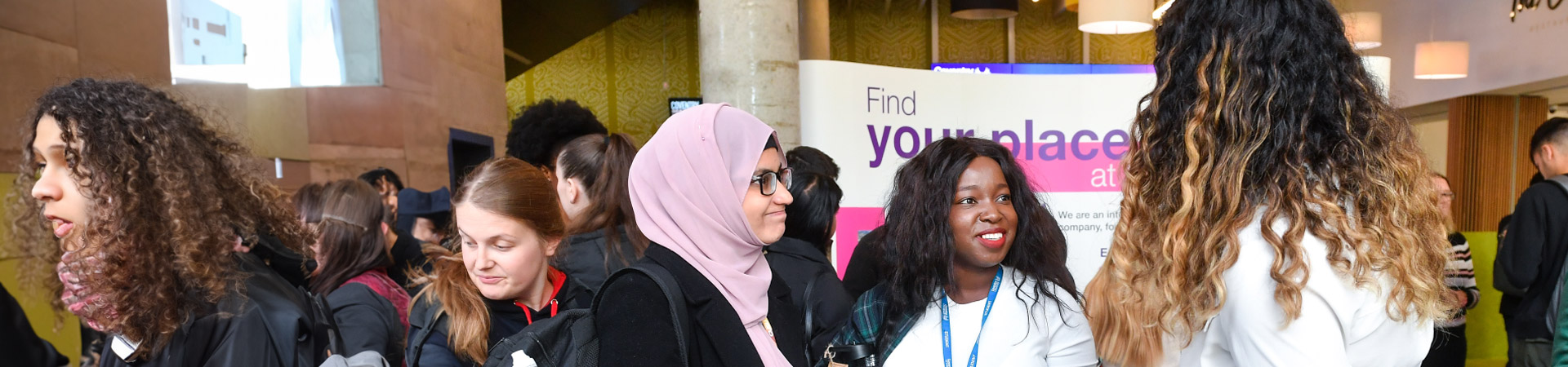 Student ambassador talking to students at an event